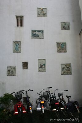 Cool reliefs in the wall on the side of the house.