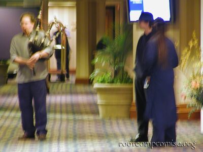 A blurry Renderman hunting a blurry bagpipe player.