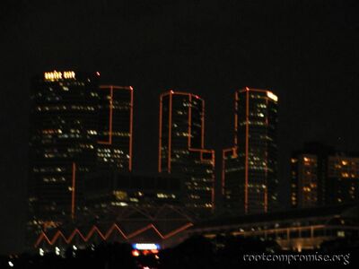 The finger looking buildings at night.