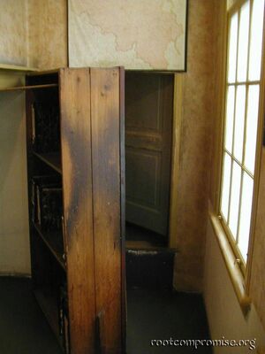 The secret entrance behind the bookcase.