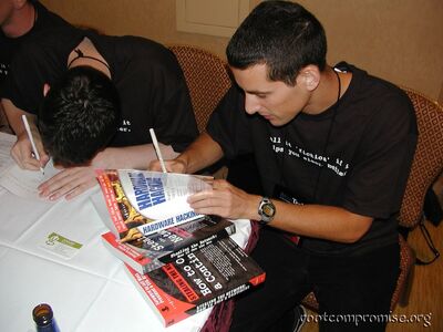 Joe Grand signing books.
