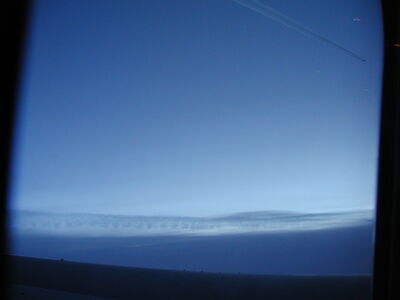A plane flying close to my plane over the Atlantic Ocean.