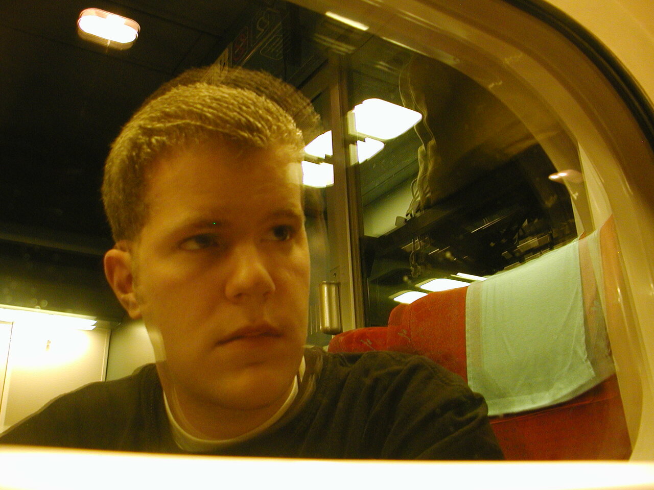 Self Portrait.  Reflection on the train to Paris.